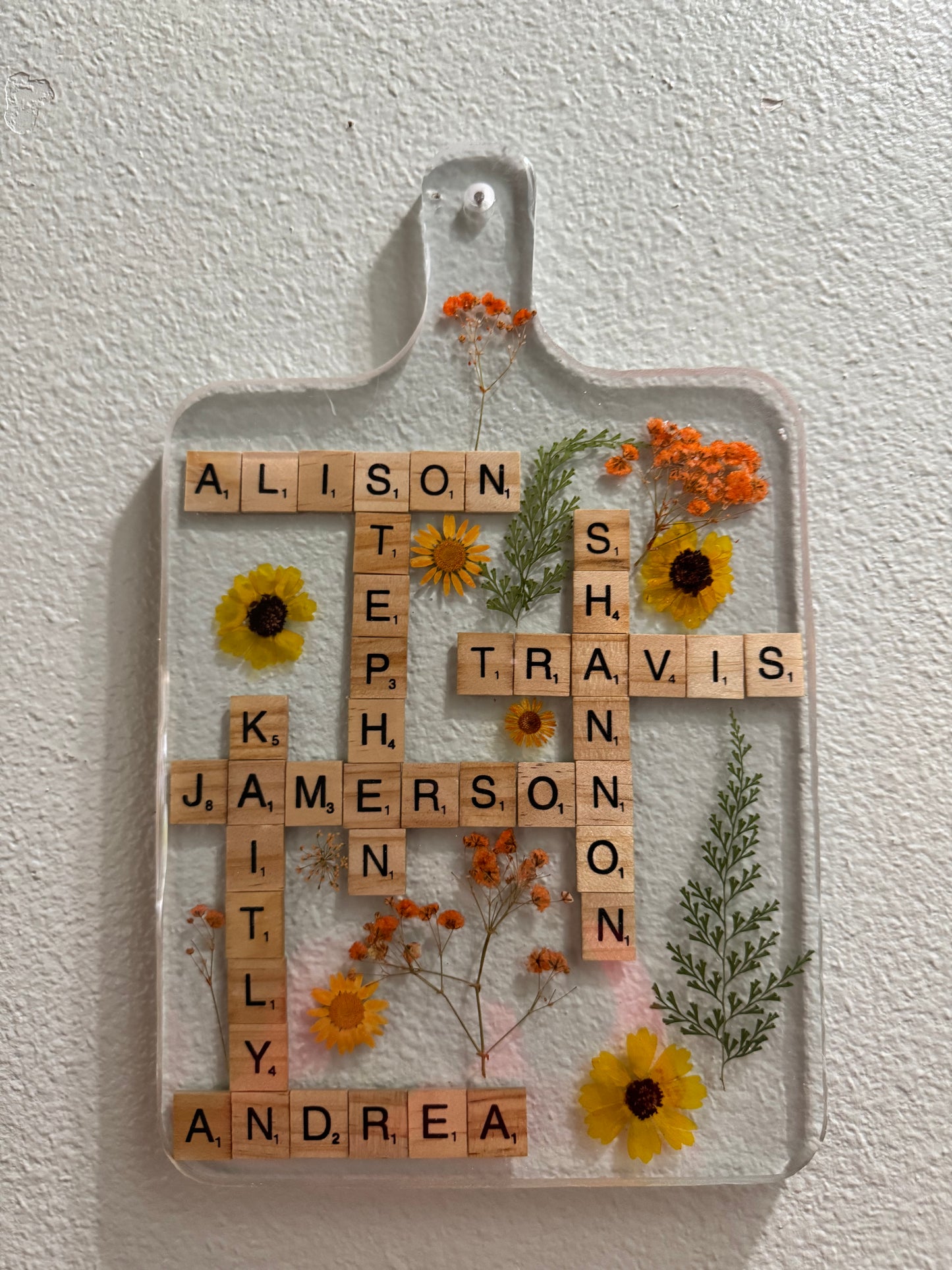 Custom resin charcuterie board with scrabble letters and pressed flowers